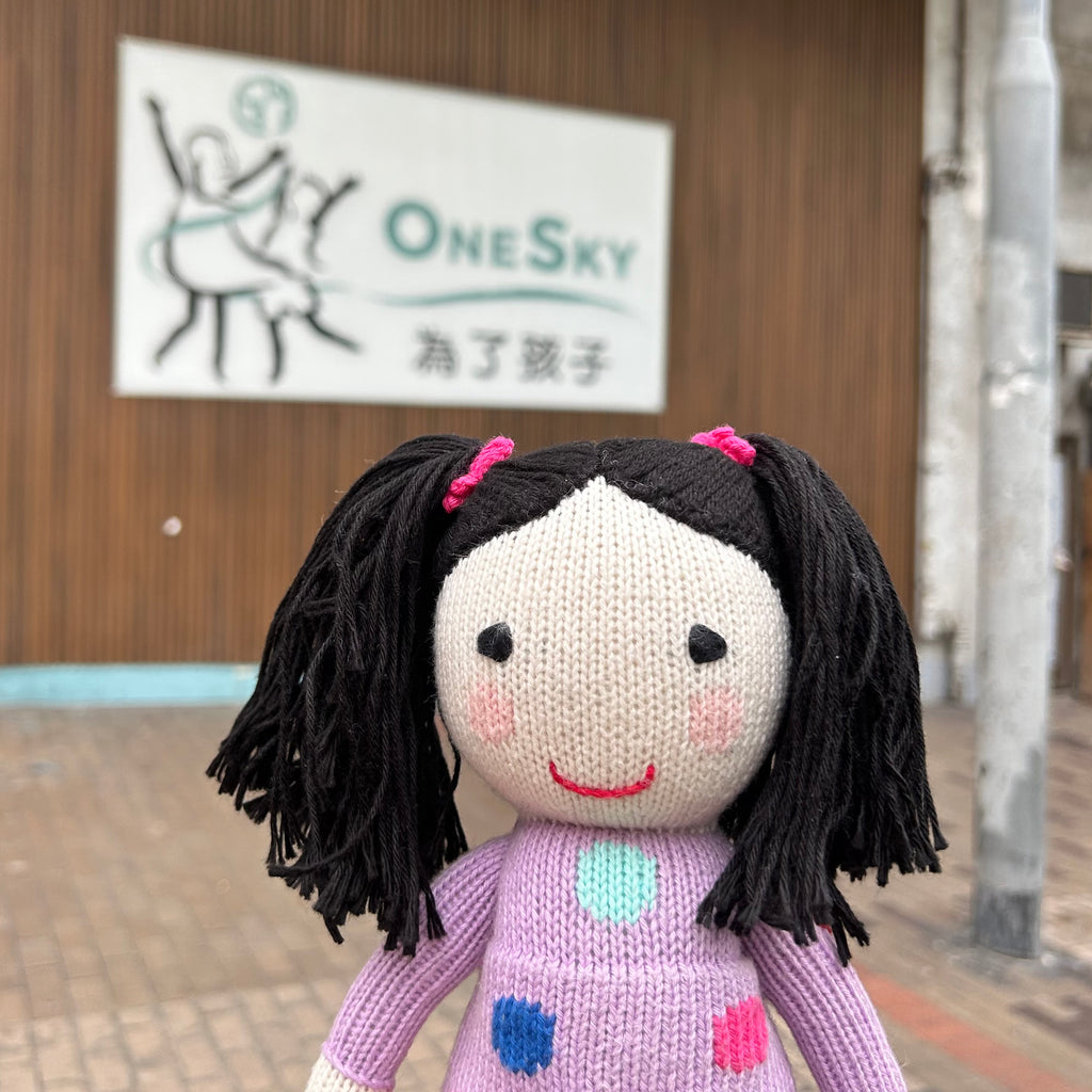 Ming Li Global Kidizen doll in front of OneSky Global Centre in Hong Kong
